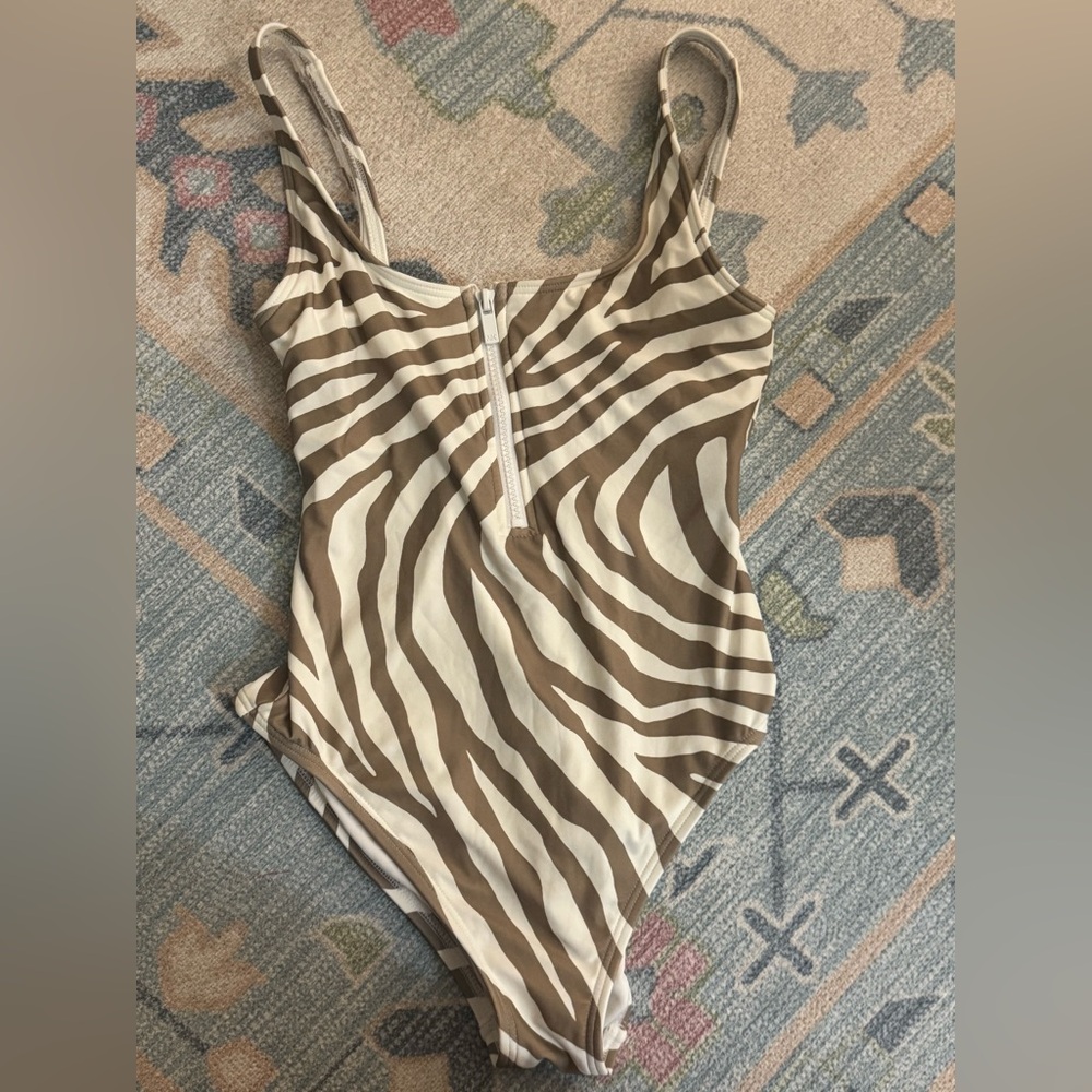 This is the cutest one piece. EUC. Not sure it was worn at all